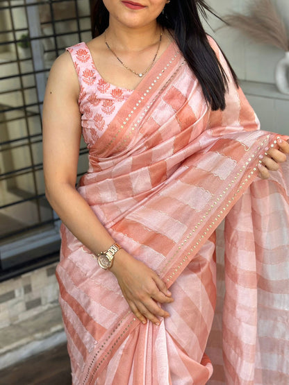 Wrap yourself in whispers of luxury- a saree that embraces you with elegance and style