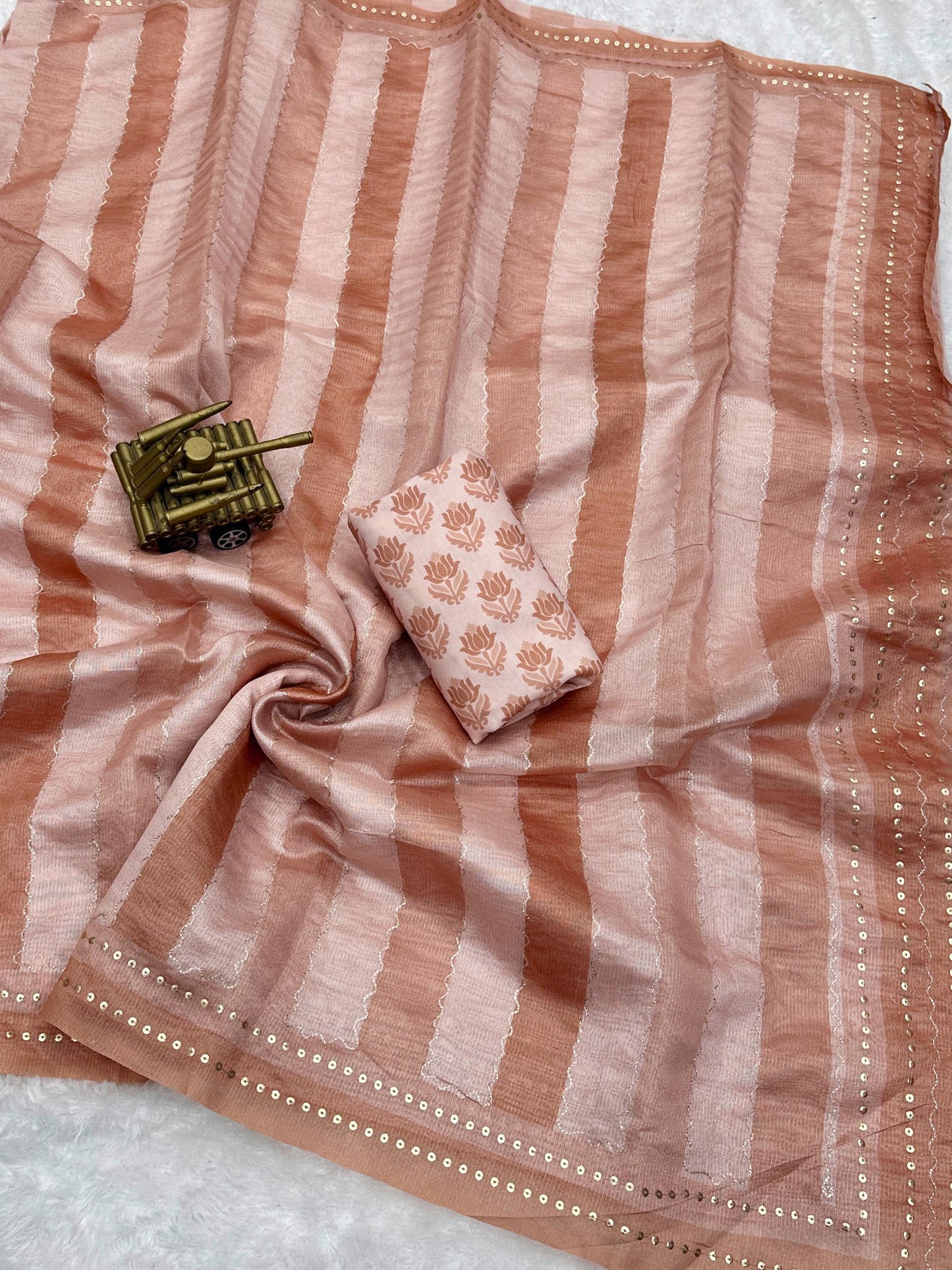 Wrap yourself in whispers of luxury- a saree that embraces you with elegance and style